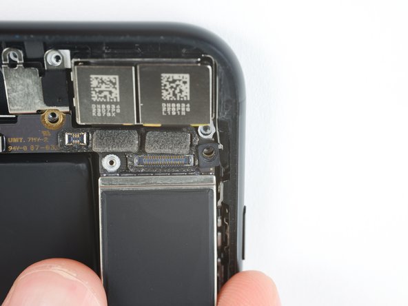 Be careful not to snag the logic board on any cables.