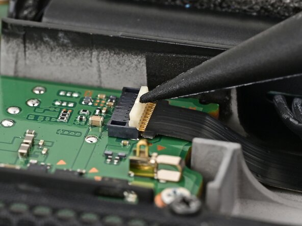 Nintendo Switch 2 Board Replacement, Disconnect the left Joy‑Con 2 connector: crwdns2935265:056crwdnd2935265:02crwdnd2935265:02crwdne2935265:0