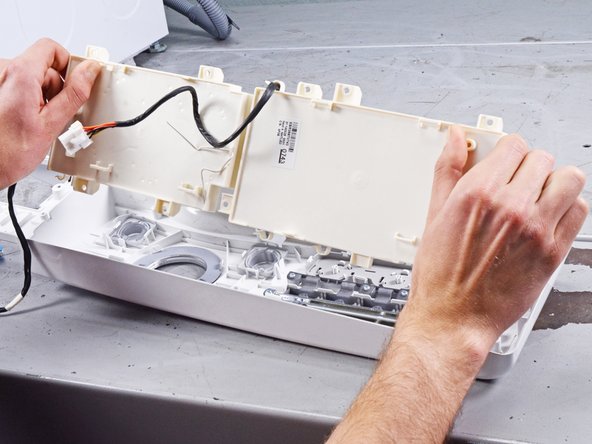 LG Front Load Washing Machine Control Panel Replacement, Remove the control panel board: crwdns2935265:013crwdnd2935265:02crwdnd2935265:03crwdne2935265:0