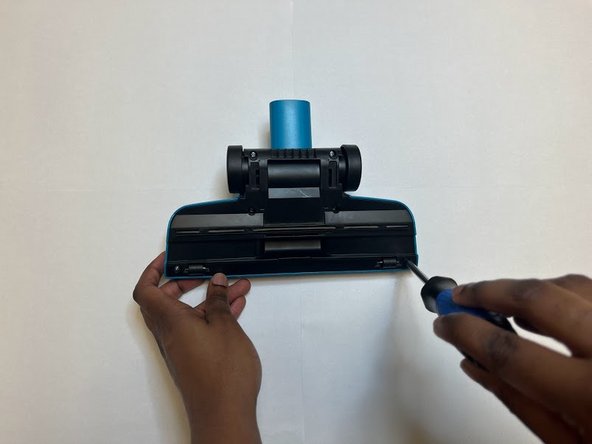 Disassembly and Cleaning of Series 2033 Bissell Featherweight Stick Bagless Vacuum Cleaner, Unscrew Base Plate of Foot: step 3, image 2 of 2