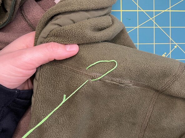 Herringbone Stitch on a Split Seam, Make a diagonal stitch: crwdns2935265:05crwdnd2935265:02crwdnd2935265:03crwdne2935265:0