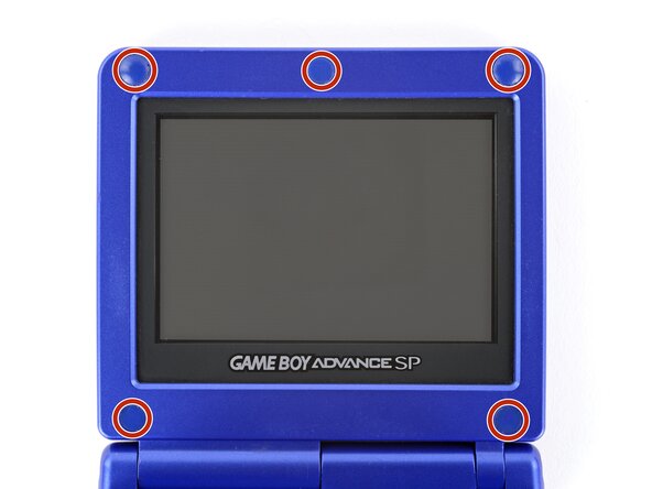 How to Reshell Your Game Boy Advance SP, Remove the rubber screw covers: crwdns2935265:019crwdnd2935265:01crwdnd2935265:03crwdne2935265:0