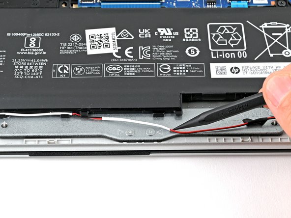 HP 15-fc0000 Series Speakers Replacement, Move the speaker wires: crwdns2935265:09crwdnd2935265:02crwdnd2935265:03crwdne2935265:0