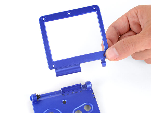 How to Reshell Your Game Boy Advance SP, Remove the screen bezel: crwdns2935265:030crwdnd2935265:03crwdnd2935265:03crwdne2935265:0
