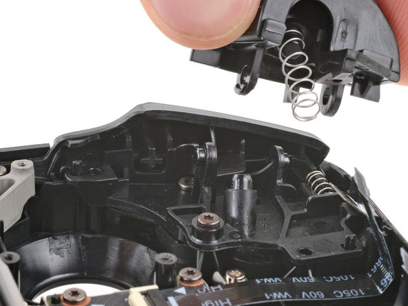 Steam Deck OLED Front Shell Replacement, Remove the left trigger: crwdns2935265:039crwdnd2935265:03crwdnd2935265:03crwdne2935265:0