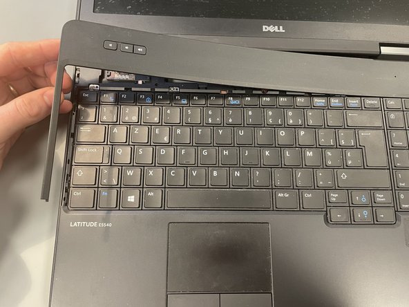 Dell Latitude E5540 Disassembly, Remove the Top Panel: crwdns2935265:08crwdnd2935265:02crwdnd2935265:03crwdne2935265:0