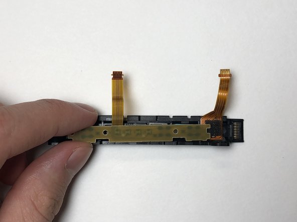 Left Joy-Con Charging Rail Replacement: crwdns2935265:010crwdnd2935265:02crwdnd2935265:03crwdne2935265:0