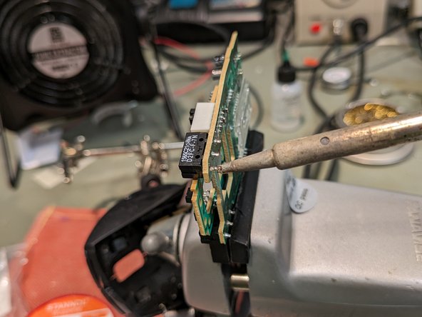 Logitech M500 Mouse Switch Replacement, Solder the replacement switch: crwdns2935265:011crwdnd2935265:02crwdnd2935265:02crwdne2935265:0