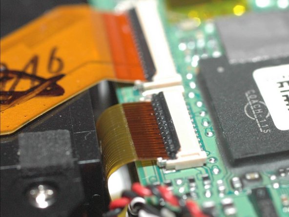 Repairing Casio Exilim EX-Z350 Lens mechanics, Remove lens body ribbon cable: crwdns2935265:010crwdnd2935265:02crwdnd2935265:03crwdne2935265:0