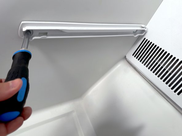 Frigidaire Side-By-Side Refrigerator Evaporator Fan Cover Removal, Remove left side freezer drawer rail: crwdns2935265:07crwdnd2935265:02crwdnd2935265:02crwdne2935265:0