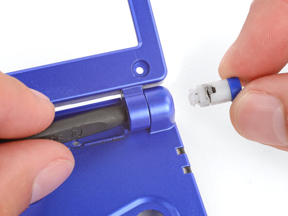 How to Reshell Your Game Boy Advance SP, Remove the right hinge: crwdns2935265:029crwdnd2935265:02crwdnd2935265:02crwdne2935265:0
