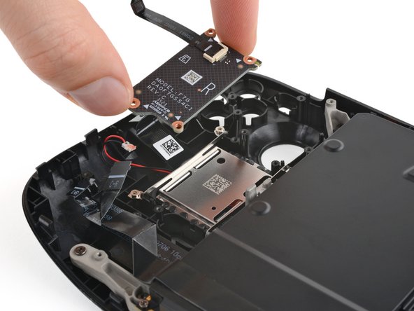 Steam Deck OLED Front Shell Replacement, Remove the right touchpad board: crwdns2935265:066crwdnd2935265:02crwdnd2935265:02crwdne2935265:0