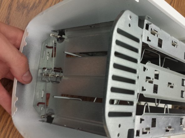 Proctor Silex® 2-Slice Extra Wide Slot Toaster Teardown, Open flanges for housing removal: crwdns2935265:06crwdnd2935265:03crwdnd2935265:03crwdne2935265:0