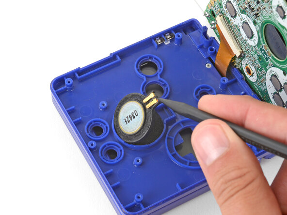 How to Reshell Your Game Boy Advance SP, Remove the speaker: crwdns2935265:012crwdnd2935265:02crwdnd2935265:03crwdne2935265:0