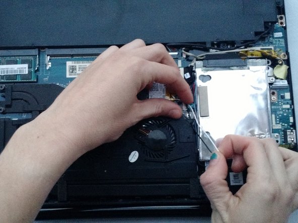 Lenovo IdeaPad Y40-70 Laptop Fan Replacement, Loosen the speaker connectors: crwdns2935265:04crwdnd2935265:02crwdnd2935265:03crwdne2935265:0