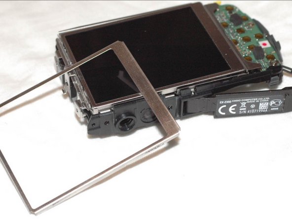 Repairing Casio Exilim EX-Z350 Lens mechanics, Remove display frame: crwdns2935265:06crwdnd2935265:03crwdnd2935265:03crwdne2935265:0