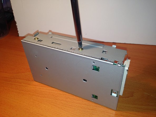 Apple 3.5 Drive External Floppy Drive Teardown, Unscrewing the Floppy Mechanism From Chassis: crwdns2935265:08crwdnd2935265:02crwdnd2935265:03crwdne2935265:0