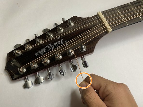 12-String Takamine G Series Guitar String Replacement: crwdns2935265:06crwdnd2935265:02crwdnd2935265:03crwdne2935265:0