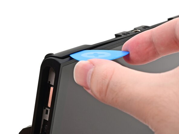 Nintendo Switch 2 Microphone Replacement, Insert an opening pick: crwdns2935265:013crwdnd2935265:02crwdnd2935265:02crwdne2935265:0