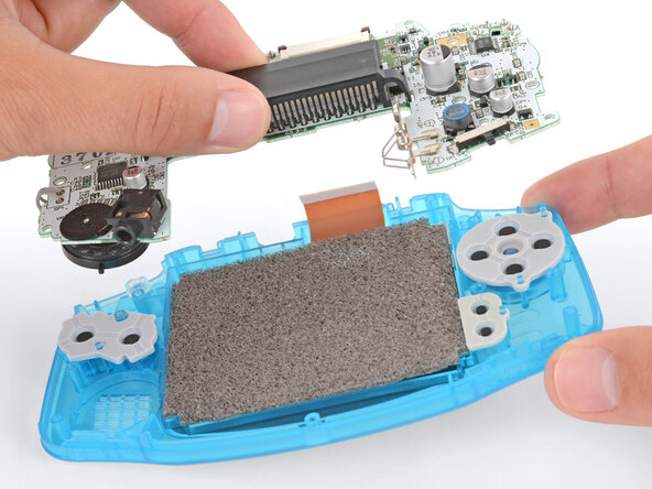 How to Reshell Your Game Boy Advance, Insert the motherboard: crwdns2935265:026crwdnd2935265:01crwdnd2935265:03crwdne2935265:0