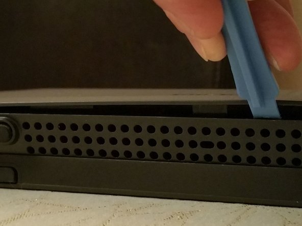 Serial Port and JTAG ports on a TalkTalk WiFi Hub, Releasing the Outer Clips: step 1, image 2 of 3