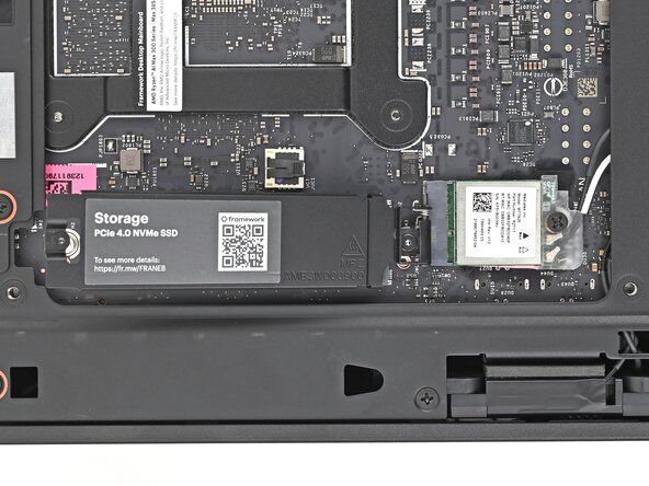 Framework Desktop DIY Edition Quick Start Guide, Remove the secondary storage heat spreader screw: crwdns2935265:025crwdnd2935265:03crwdnd2935265:03crwdne2935265:0