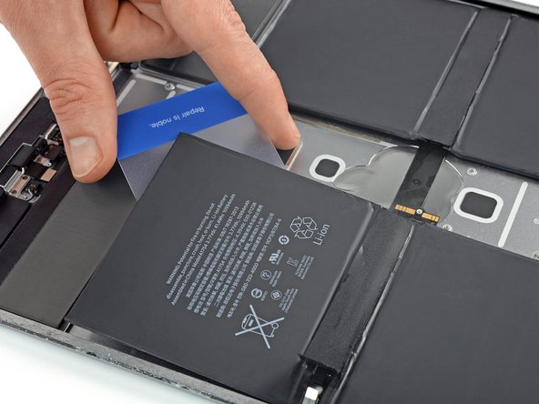 iPad Pro 12.9" 2nd Gen Battery Replacement, Loosen the top left battery cell: crwdns2935265:072crwdnd2935265:03crwdnd2935265:03crwdne2935265:0