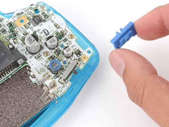 How to Reshell Your Game Boy Advance, Install the power switch cover: crwdns2935265:030crwdnd2935265:01crwdnd2935265:03crwdne2935265:0