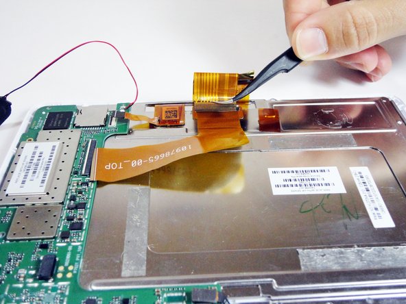 HP 7 1800 Display Replacement, Remove the ribbon cable attached to the metal plate: crwdns2935265:08crwdnd2935265:02crwdnd2935265:02crwdne2935265:0