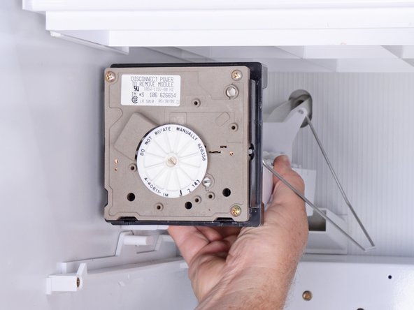 How to Replace the Ice Maker in an Older Whirlpool Refrigerator, Releasing the ice maker: step 9, image 1 of 3