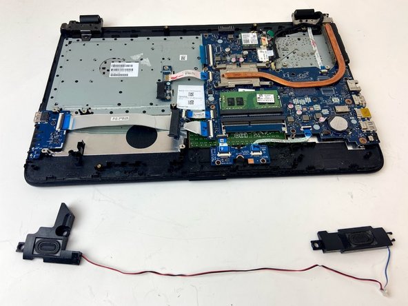HP 15-ay114cy Speakers Replacement, Insert the Replacement Speakers: crwdns2935265:08crwdnd2935265:02crwdnd2935265:03crwdne2935265:0