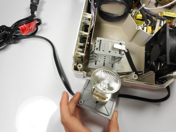 Merch Source Projector Entertainment II Light Bulb Replacement, Remove light bulb assembly from housing unit: crwdns2935265:04crwdnd2935265:02crwdnd2935265:03crwdne2935265:0