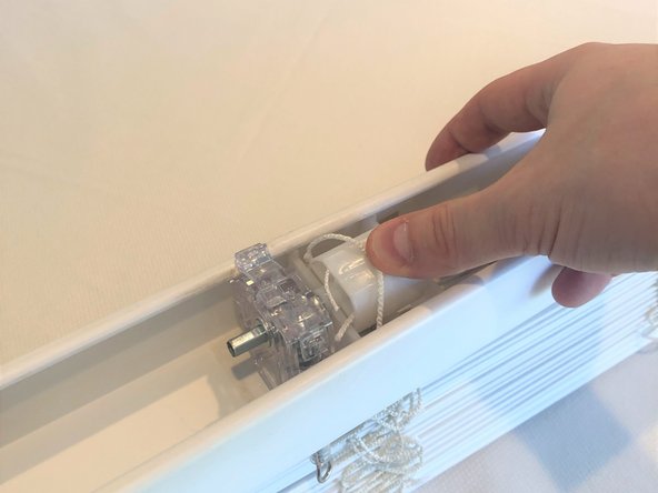 Once slid into position, reinsert the center rod by pushing down on the assembly.