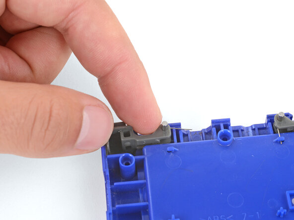 How to Install Shoulder Buttons in Your Game Boy Advance SP, Put the shoulder button in place: crwdns2935265:03crwdnd2935265:02crwdnd2935265:03crwdne2935265:0