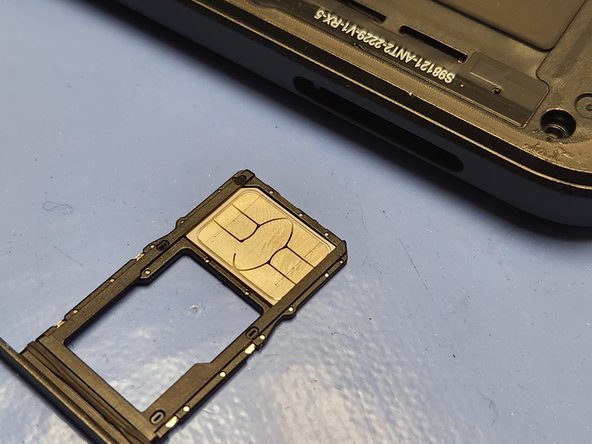 Revvl 6 Pro 5G Screen Replacement, Remove the Sim Card Tray: crwdns2935265:012crwdnd2935265:03crwdnd2935265:03crwdne2935265:0