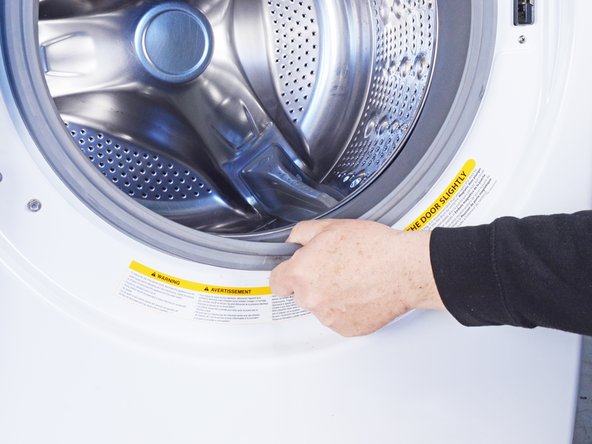 How to Clean the Rubber Boot in Your LG WM3050CW Washing Machine, Pull the boot: step 6, image 1 of 2