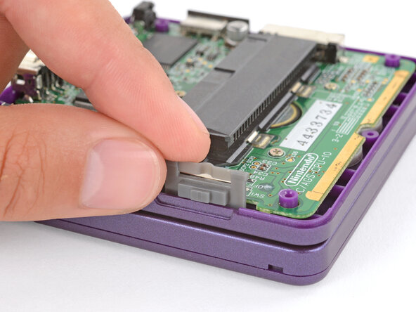 How to Reshell Your Game Boy Advance SP, Install the power switch cover: crwdns2935265:061crwdnd2935265:02crwdnd2935265:03crwdne2935265:0