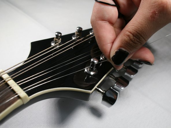 How to Replace the Strings on your Rogue RM-100A A-Style Mandolin: step 5, image 2 of 2