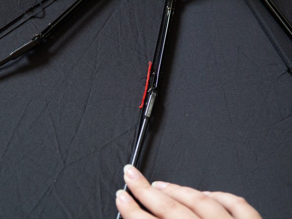 How to Reattach a Metal Rib to Fabric Panel on an Umbrella: step 4, image 2 of 3