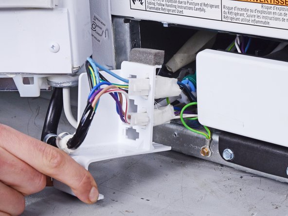 Whirlpool Refrigerator Freezer Door Replacement, Reposition the wiring harness: crwdns2935265:06crwdnd2935265:02crwdnd2935265:02crwdne2935265:0