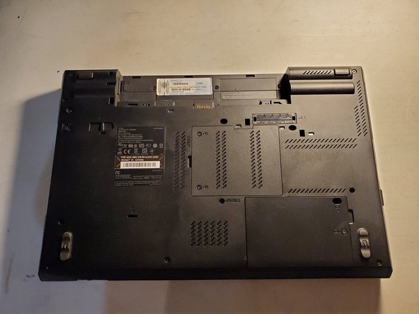 Lenovo ThinkPad T520 Battery Replacement, Remove battery: crwdns2935265:02crwdnd2935265:02crwdnd2935265:02crwdne2935265:0