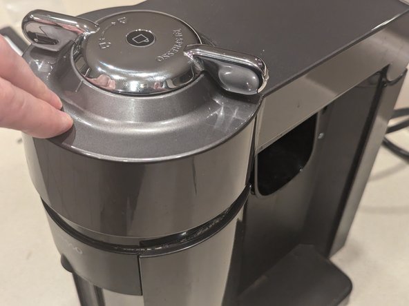 Nespresso Vertuo Evoluo Bearing Replacement, Pressing the upper cover into place: crwdns2935265:021crwdnd2935265:02crwdnd2935265:02crwdne2935265:0