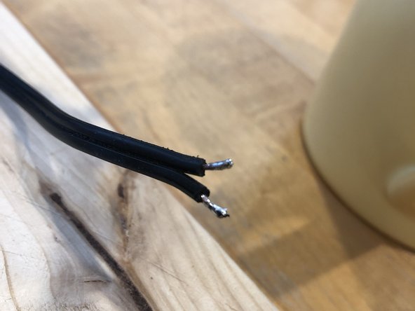 GoTrax Hoverboard charger power plug Replacement, Cut the old plug and prepare for voltage test: step 3, image 3 of 3