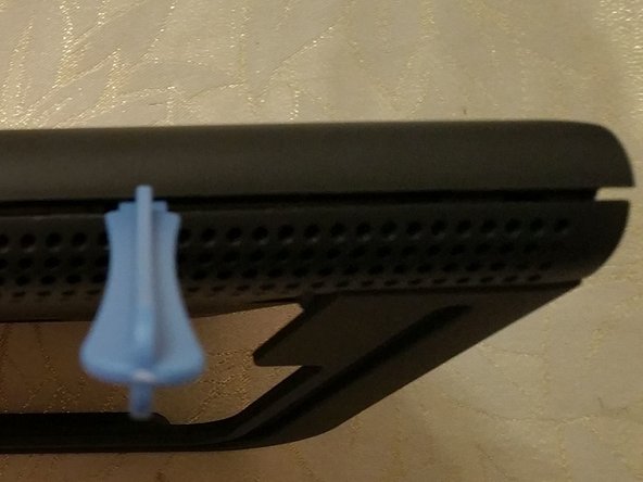 Serial Port and JTAG ports on a TalkTalk WiFi Hub, Releasing the Top Clips: step 2, image 1 of 3