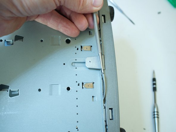 Porsche 997.1 PCM 2.1 Screen Replacement, Prying the facia away from the chassis: step 9, image 2 of 3