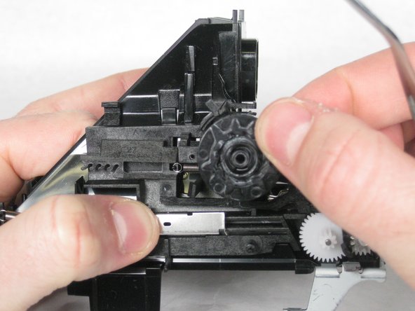 Lift the photo-counter Dial off of its pin.