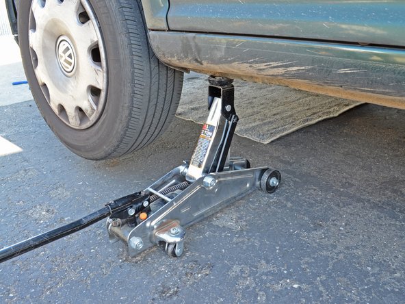 Place your jack back in the same location on the frame you used to jack up the car. Raise the jack until it touches the jacking point on the frame.