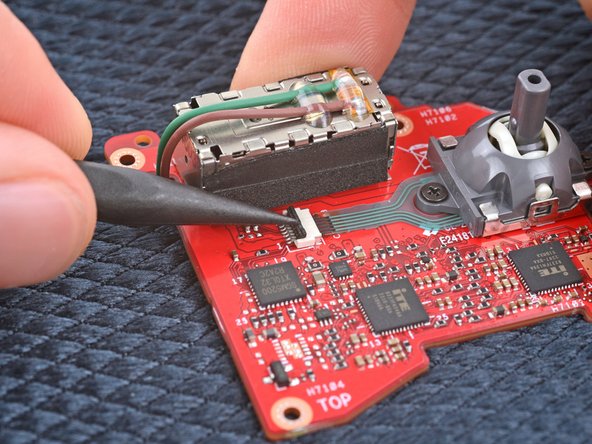 Asus ROG Ally Left Thumbstick Replacement, Lift the left thumbstick locking flap: step 17, image 2 of 2