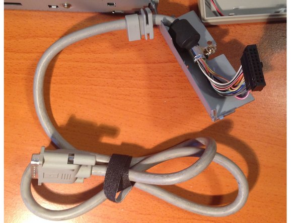 Apple 3.5 Drive External Floppy Drive Teardown, Removing the Rear Chassis Cover and External Cable: crwdns2935265:05crwdnd2935265:03crwdnd2935265:03crwdne2935265:0