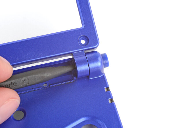 How to Reshell Your Game Boy Advance SP, Remove the right hinge: crwdns2935265:029crwdnd2935265:01crwdnd2935265:02crwdne2935265:0
